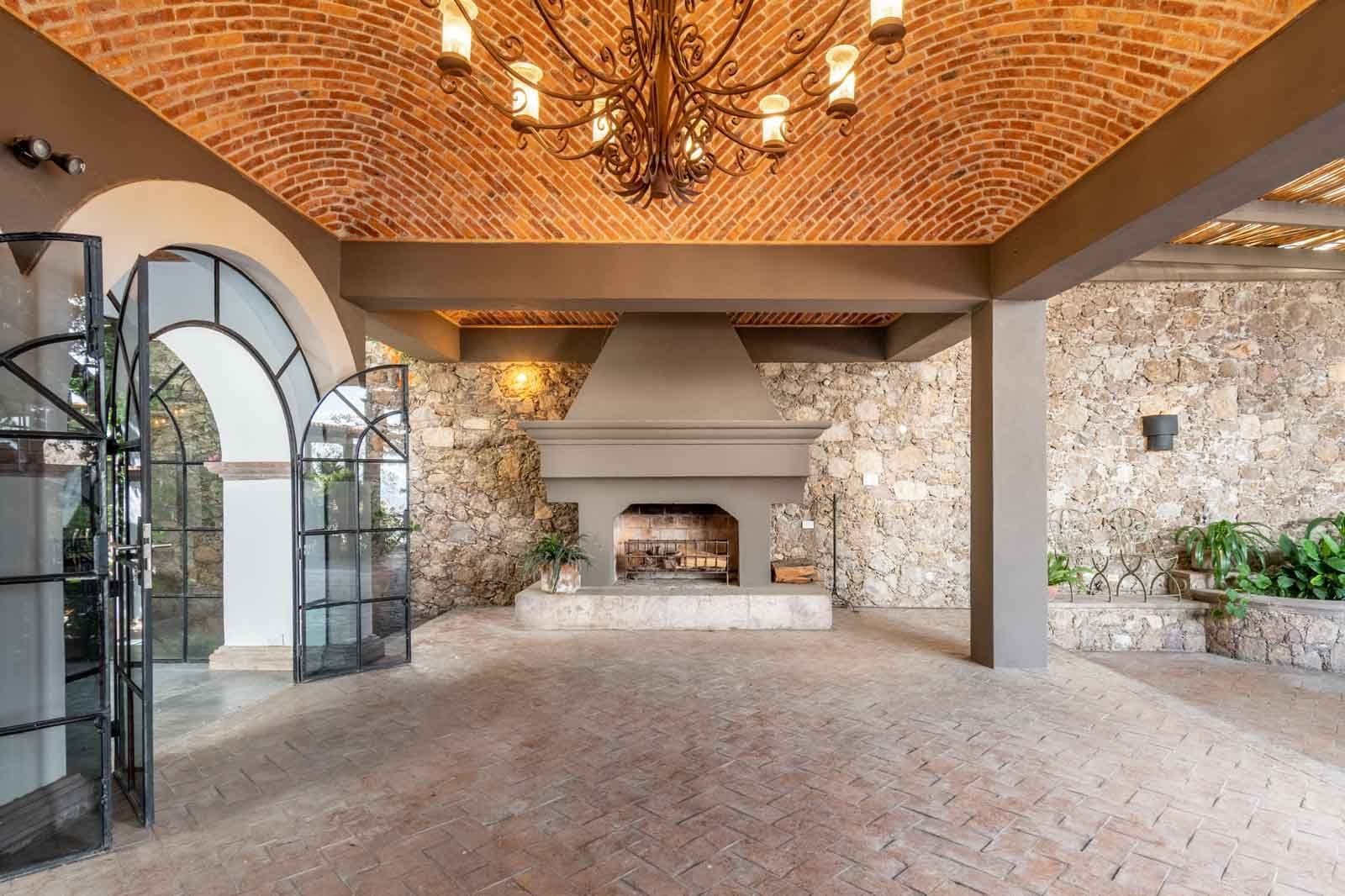 Casa Luz del Sol — Balcones, San Miguel de Allende — photo 2 — elegant courtyard with soaring brick vaulting