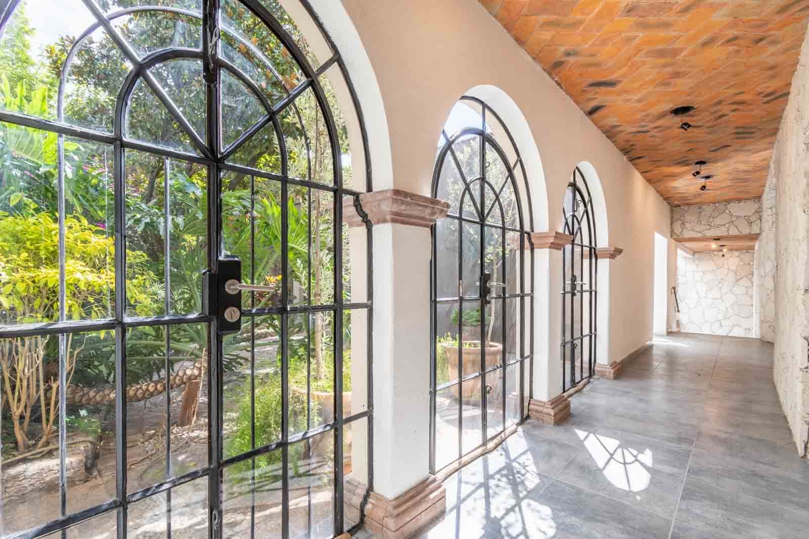 Casa Luz del Sol — Balcones, San Miguel de Allende — photo 15 — luminous arched gallery, garden views