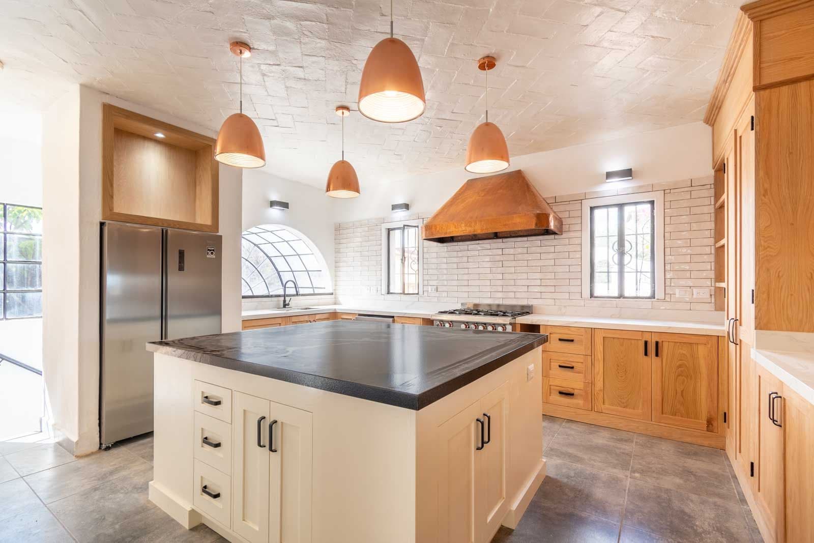 Casa Luz del Sol — Balcones, San Miguel de Allende — photo 17 — contemporary chef's kitchen, soaring ceilings, radiant warmth