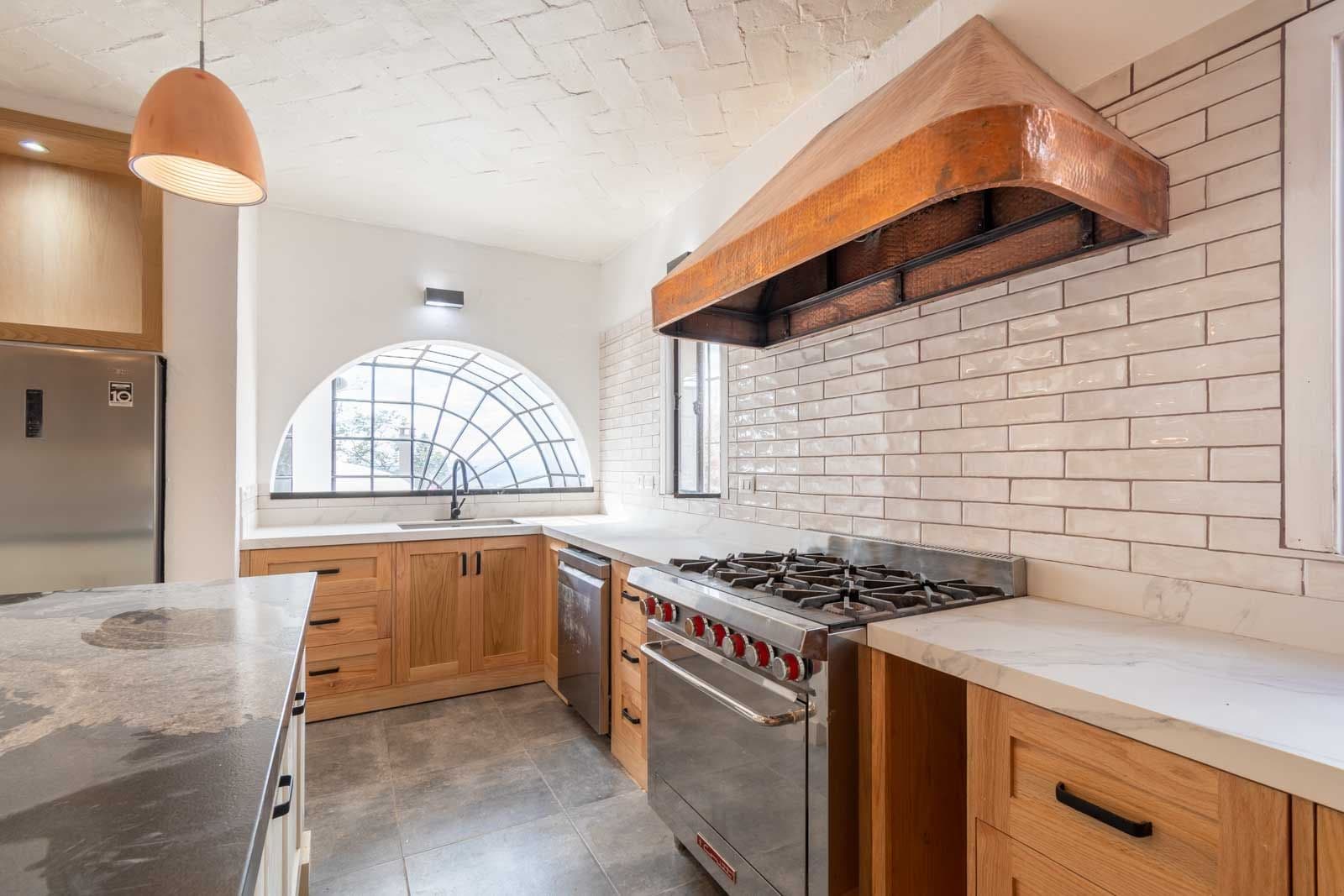 Casa Luz del Sol — Balcones, San Miguel de Allende — photo 18 — sophisticated chef's kitchen, natural luminosity