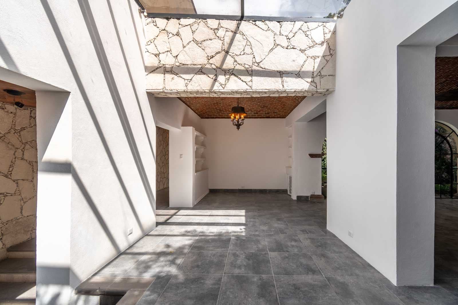 Casa Luz del Sol — Balcones, San Miguel de Allende — photo 9 — sun-drenched courtyard with soaring ceilings