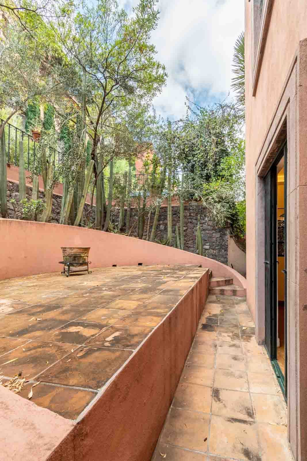 Santo Domingo Condo 3C — Centro, San Miguel de Allende — photo 11 — serene terracotta courtyard, verdant garden sanctuary