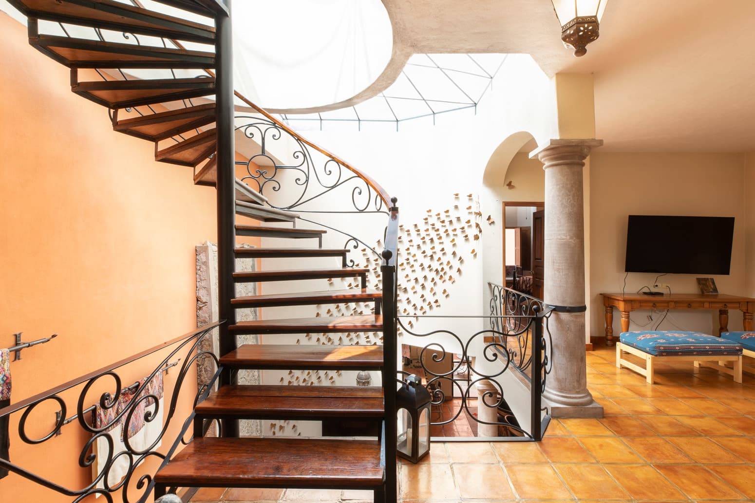 Casa Brillante — San Antonio, San Miguel de Allende — photo 7 — luminous loft with sculptural spiral staircase