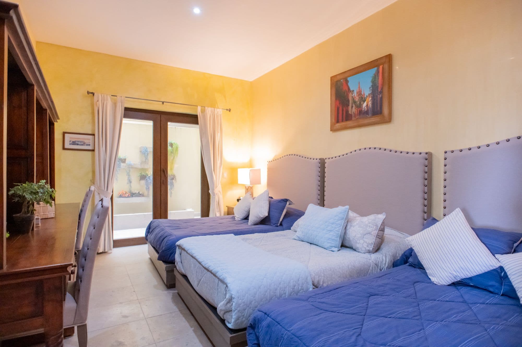 Casa Caracol — Caracol, San Miguel de Allende — photo 5 — sunlit bedroom with charming colonial elegance