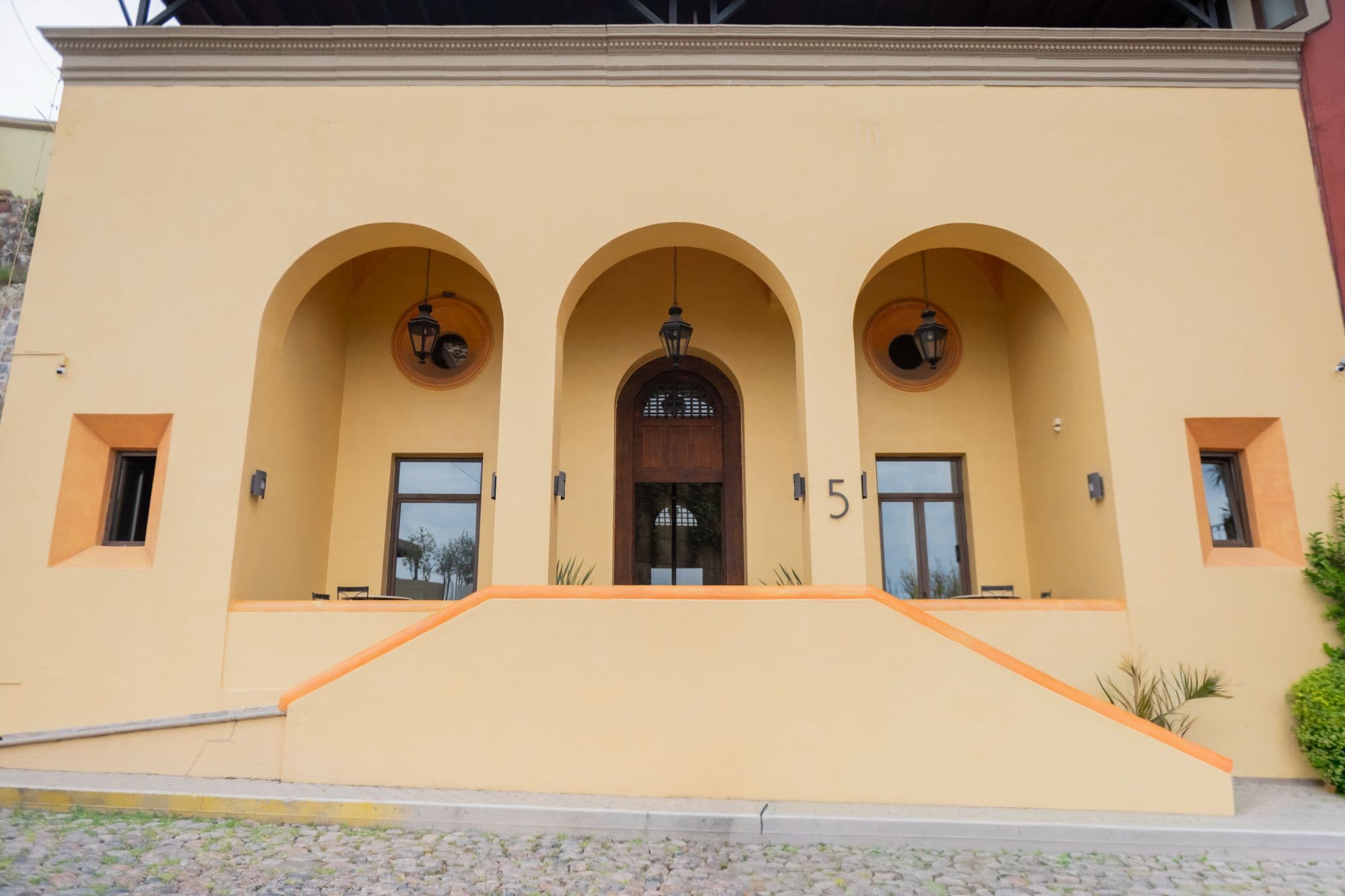 Casa Caracol — Caracol, San Miguel de Allende — photo 9 — elegant arched entry, warm colonial charm