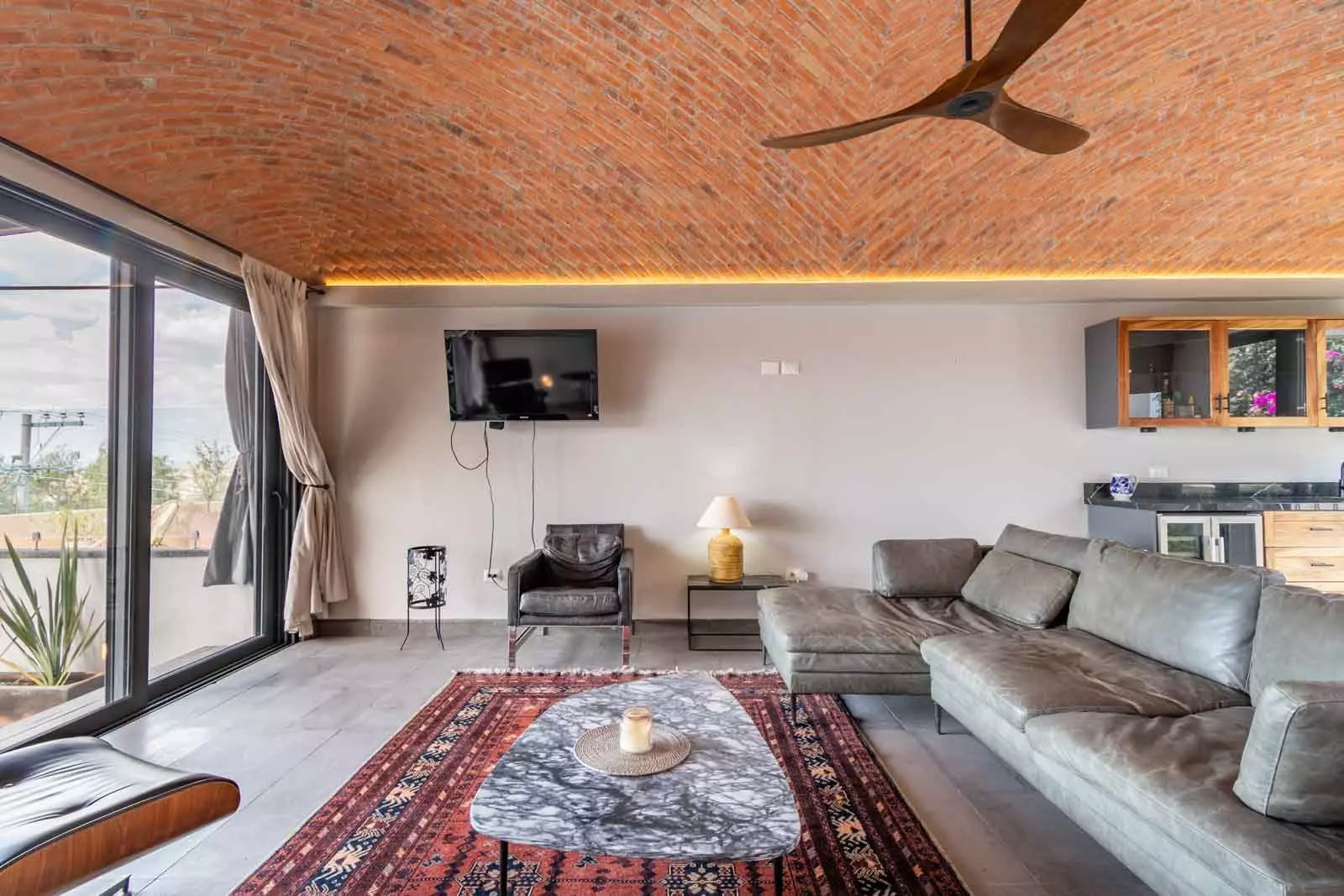 Casa Lúmina — Ojo de Agua, San Miguel de Allende — photo 22 — sunlit modern living, exposed brick elegance