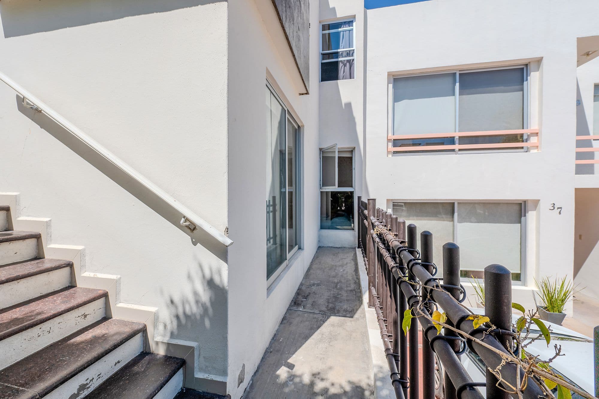 Casita Amanecer — Las Brisas, San Miguel de Allende — photo 26 — sunlit passageway, modern architectural elegance
