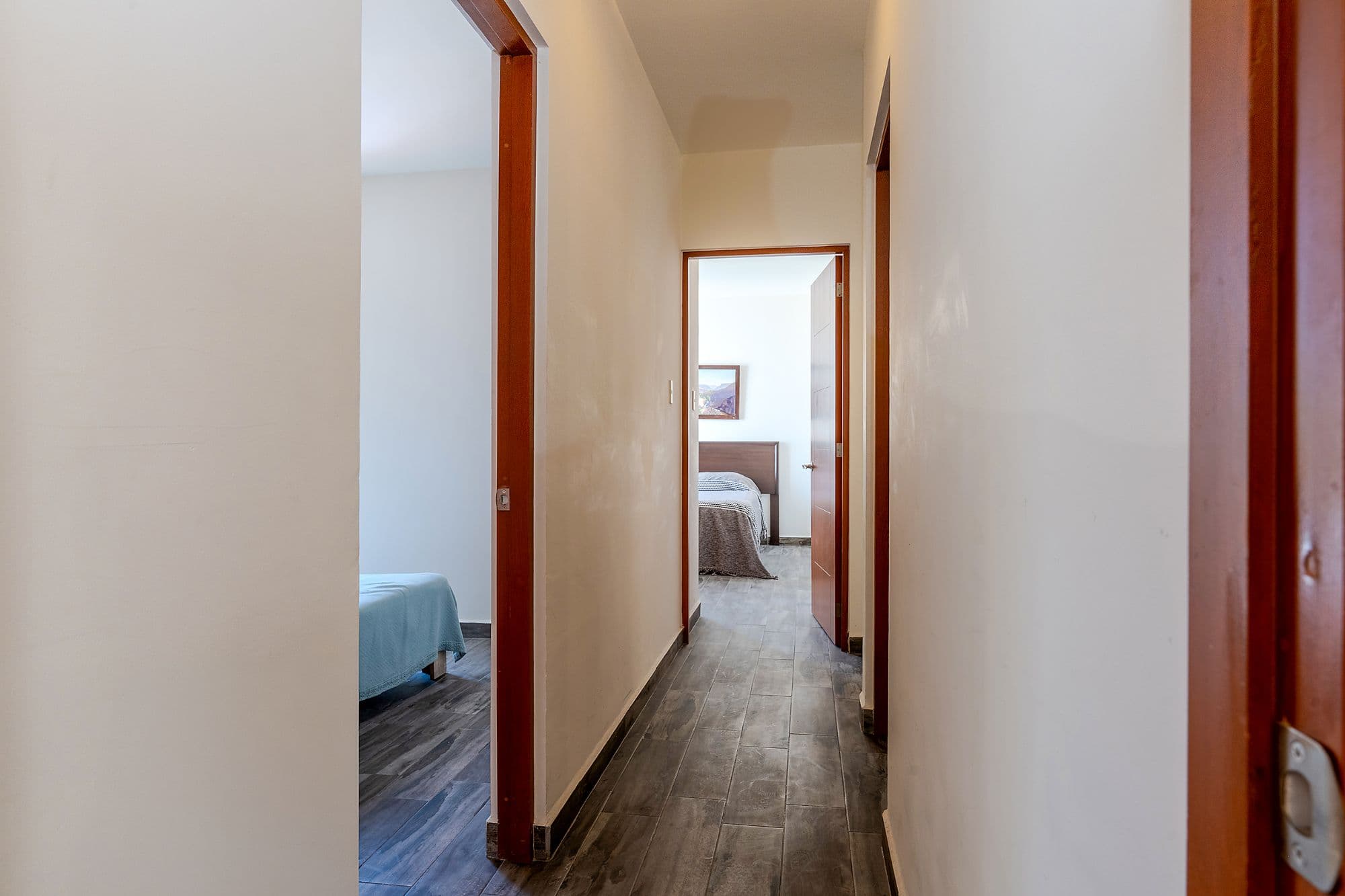 Casita Amanecer — Las Brisas, San Miguel de Allende — photo 16 — graceful hallway with warm wood accents