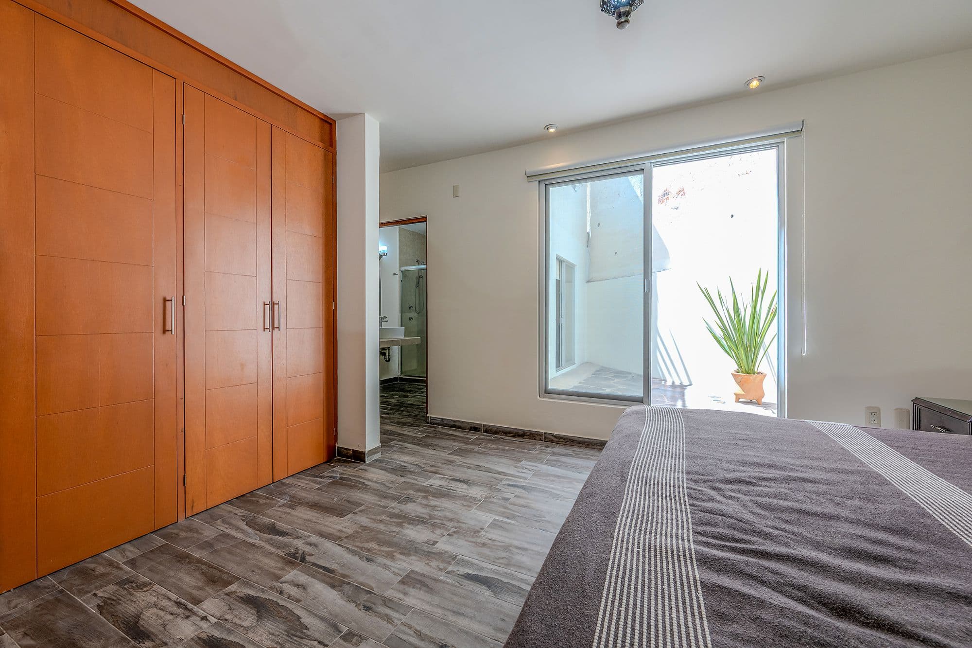 Casita Amanecer — Las Brisas, San Miguel de Allende — photo 18 — serene primary suite, abundant natural light