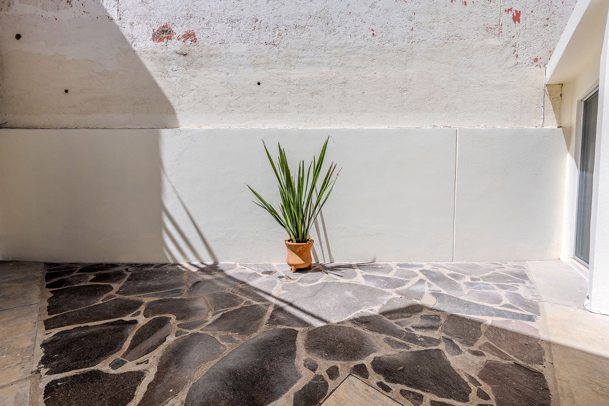 Casita Amanecer — Las Brisas, San Miguel de Allende — photo 19 — serene courtyard with authentic stonework