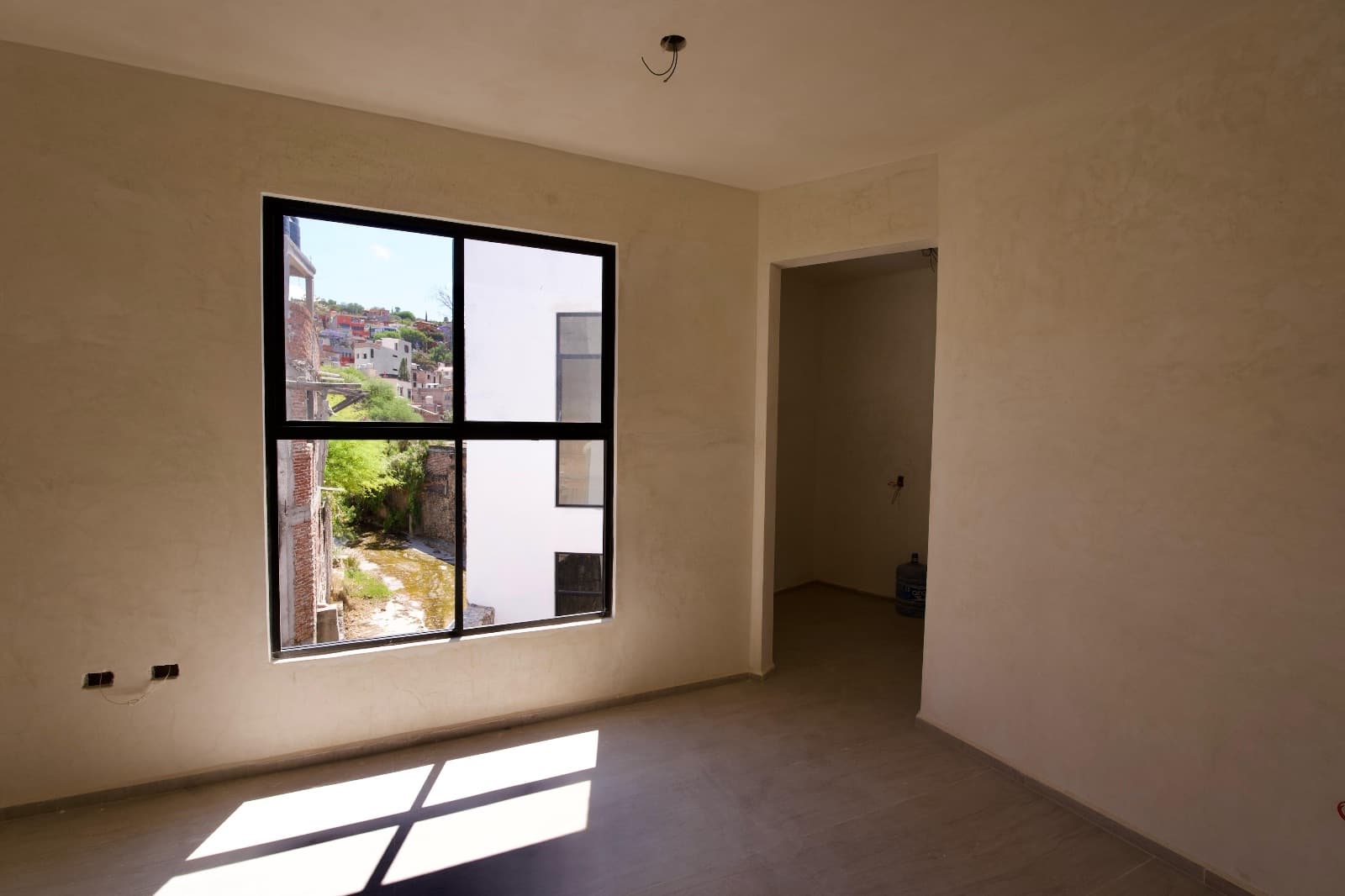 Nuñes Lofts / Loft 5 — Centro, San Miguel de Allende — photo 6 — sun-drenched room, charming hillside views