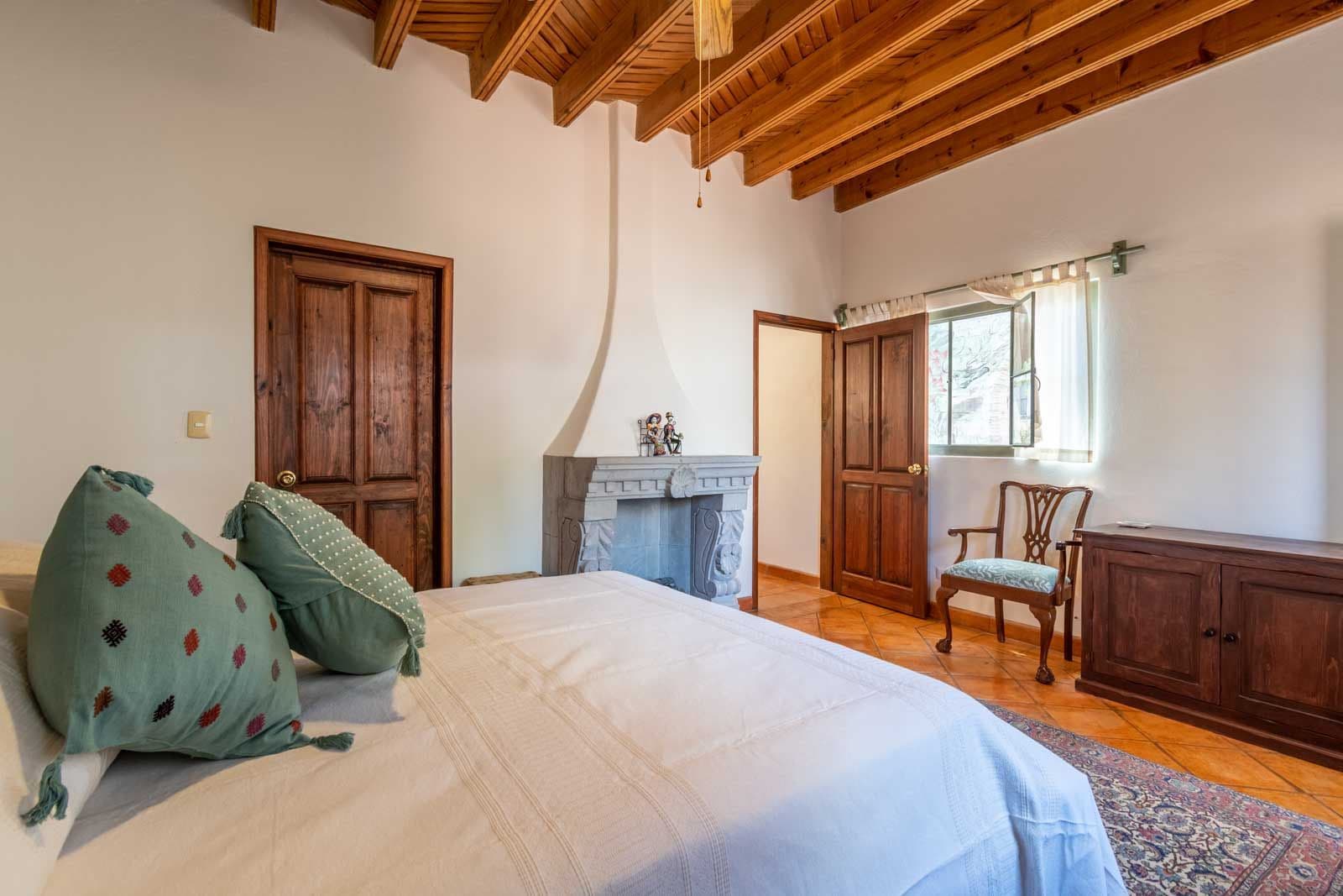 Secret Garden — San Antonio, San Miguel de Allende — photo 21 — rustic-chic bedroom with soaring beams