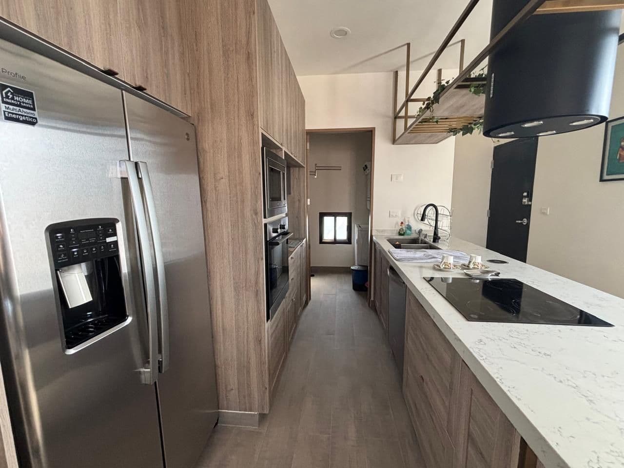 Barrio Santo PH — Barrio Santo, San Miguel de Allende — photo 2 — modern galley kitchen, stainless finishes