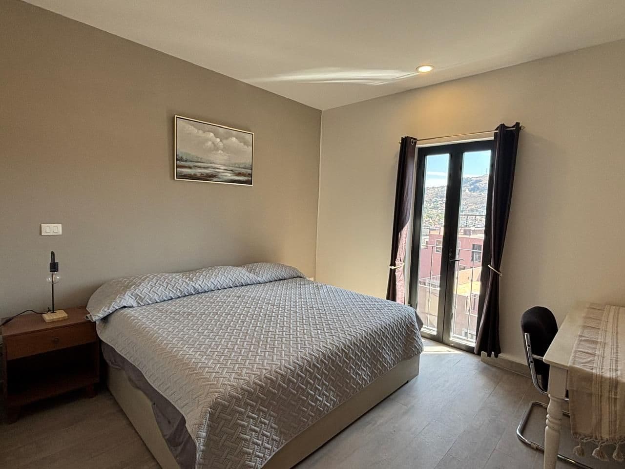 Barrio Santo PH — Barrio Santo, San Miguel de Allende — photo 8 — luminous master suite, panoramic hillside vistas