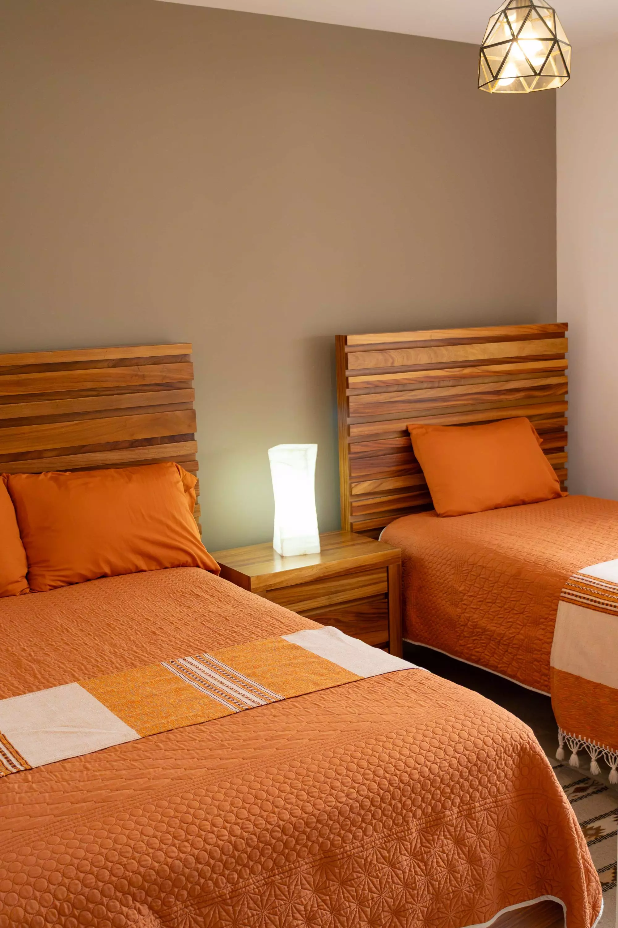 Sto Domingo PBDag La Luminaria — La Luminaria, San Miguel de Allende — photo 2 — warm twin bedroom, contemporary wood elegance