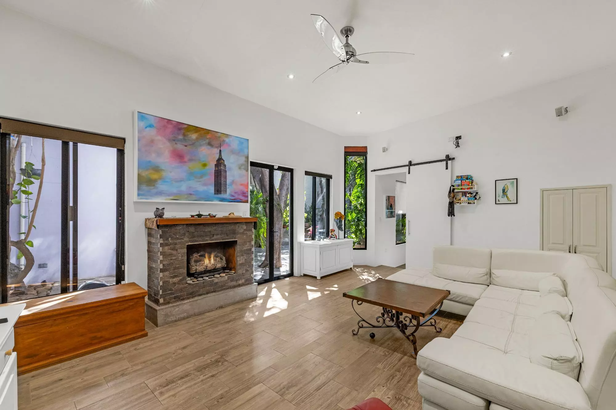 Casa Entre Arboles — San Antonio, San Miguel de Allende — photo 19 — luminous living with architectural fireplace elegance