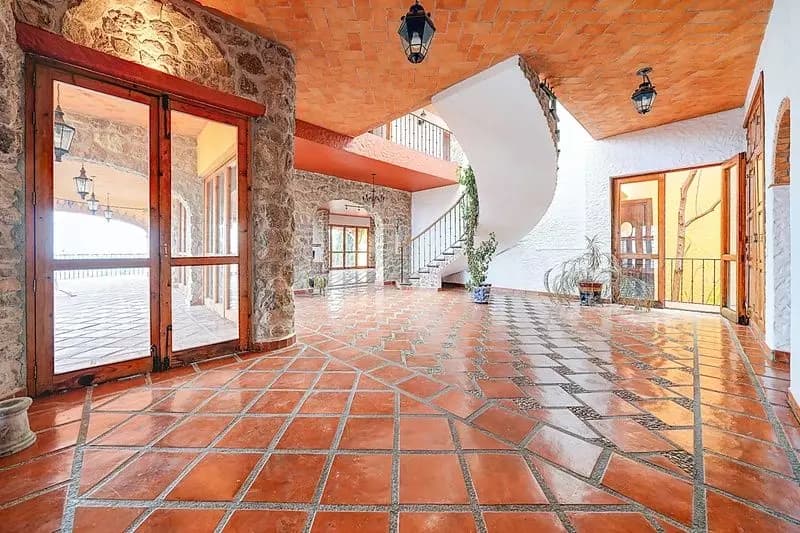 La Casona de Montitlan — Balcones, San Miguel de Allende — photo 19 — luminous terracotta floors, soaring curved architecture