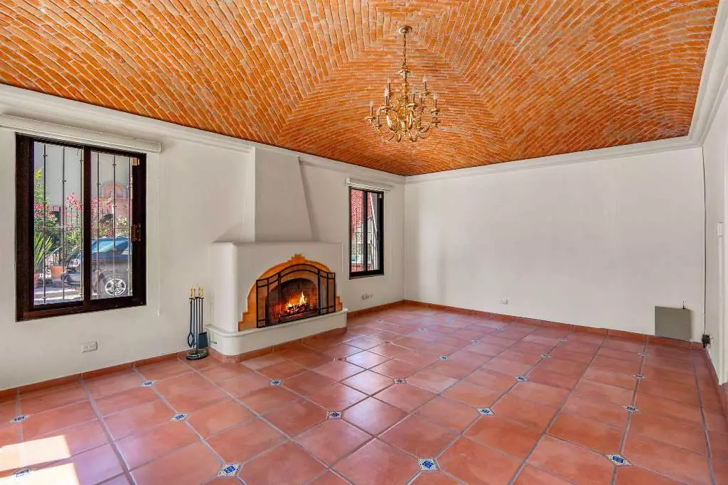 Casa Fuente Del Sol — Balcones, San Miguel de Allende — photo 5 — authentic terracotta elegance with fireplace warmth