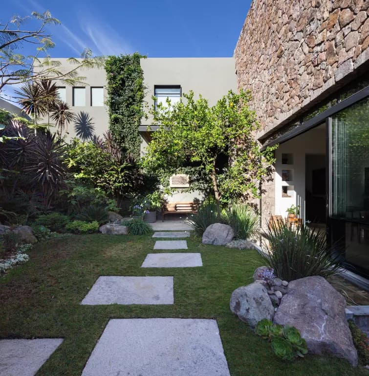 Casa Luz — Balcones, San Miguel de Allende — photo 8 — serene courtyard with lush greenery