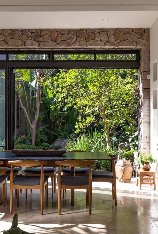 Casa Luz — Balcones, San Miguel de Allende — photo 9 — luminous dining, verdant garden views