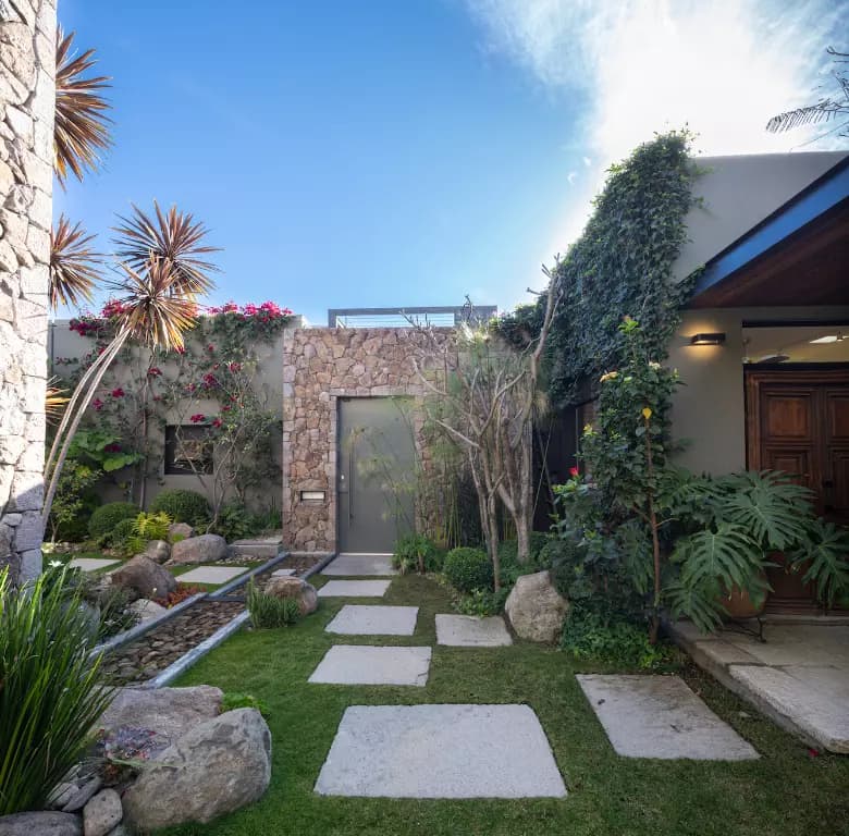 Casa Luz — Balcones, San Miguel de Allende — photo 11 — verdant courtyard, sophisticated architectural design
