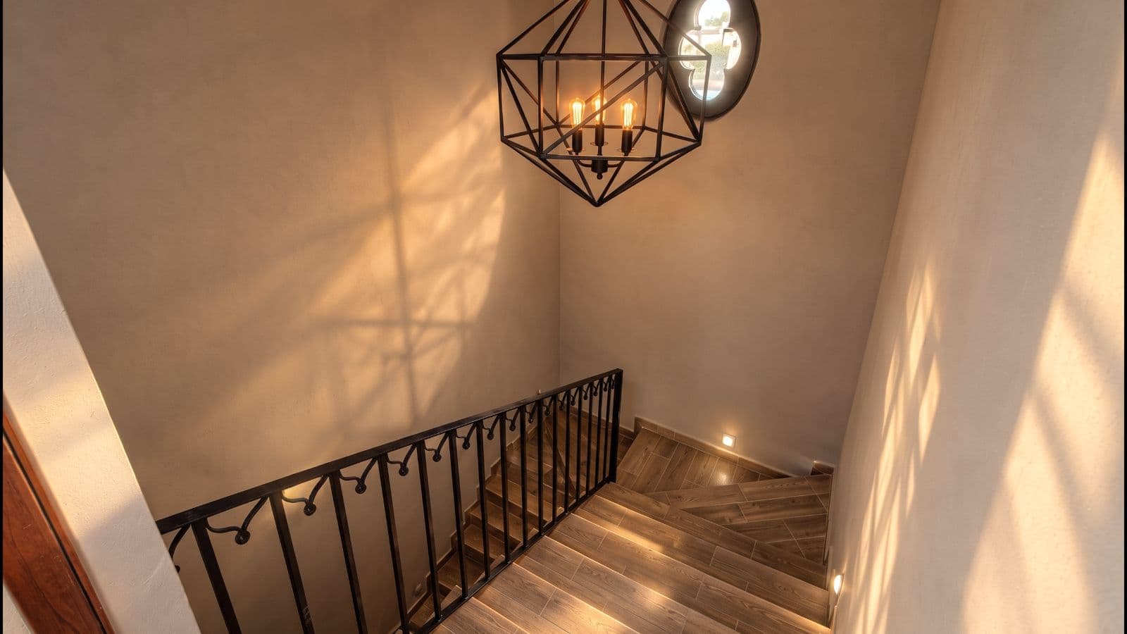 Casa Aura — Antigua Residencial, San Miguel de Allende — photo 18 — sophisticated staircase with architectural lighting