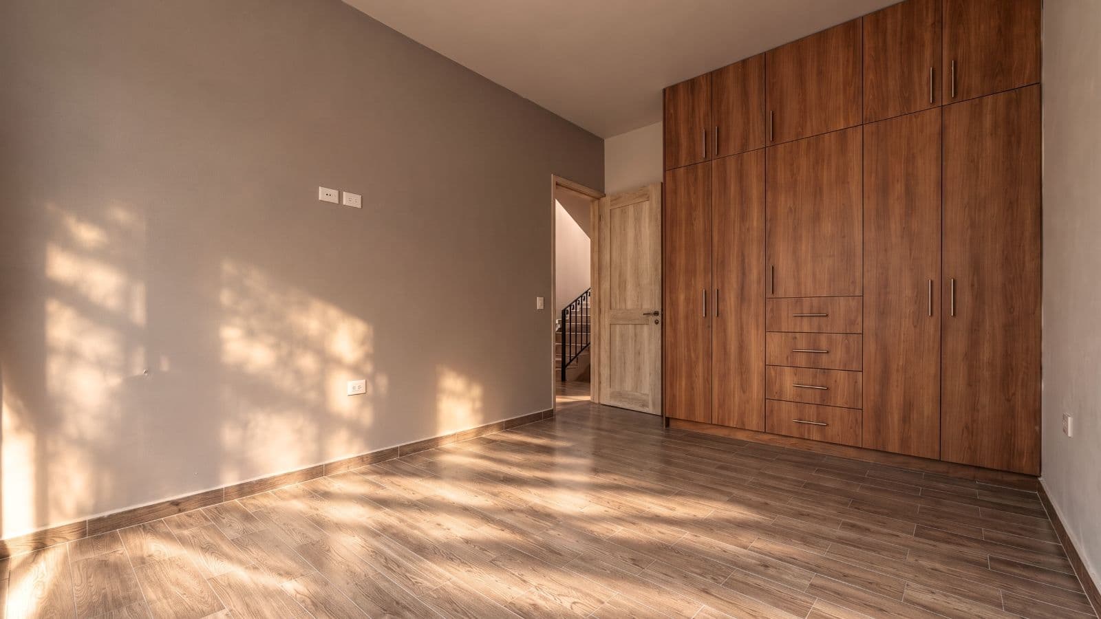 Casa Aura — Antigua Residencial, San Miguel de Allende — photo 14 — sun-drenched master suite with custom cabinetry