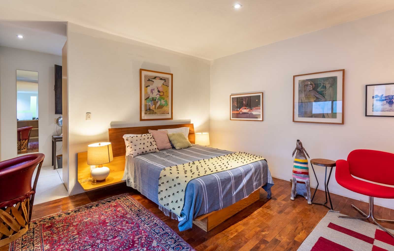 Casa Doce — Centro, San Miguel de Allende — photo 21 — sophisticated master suite with gallery walls