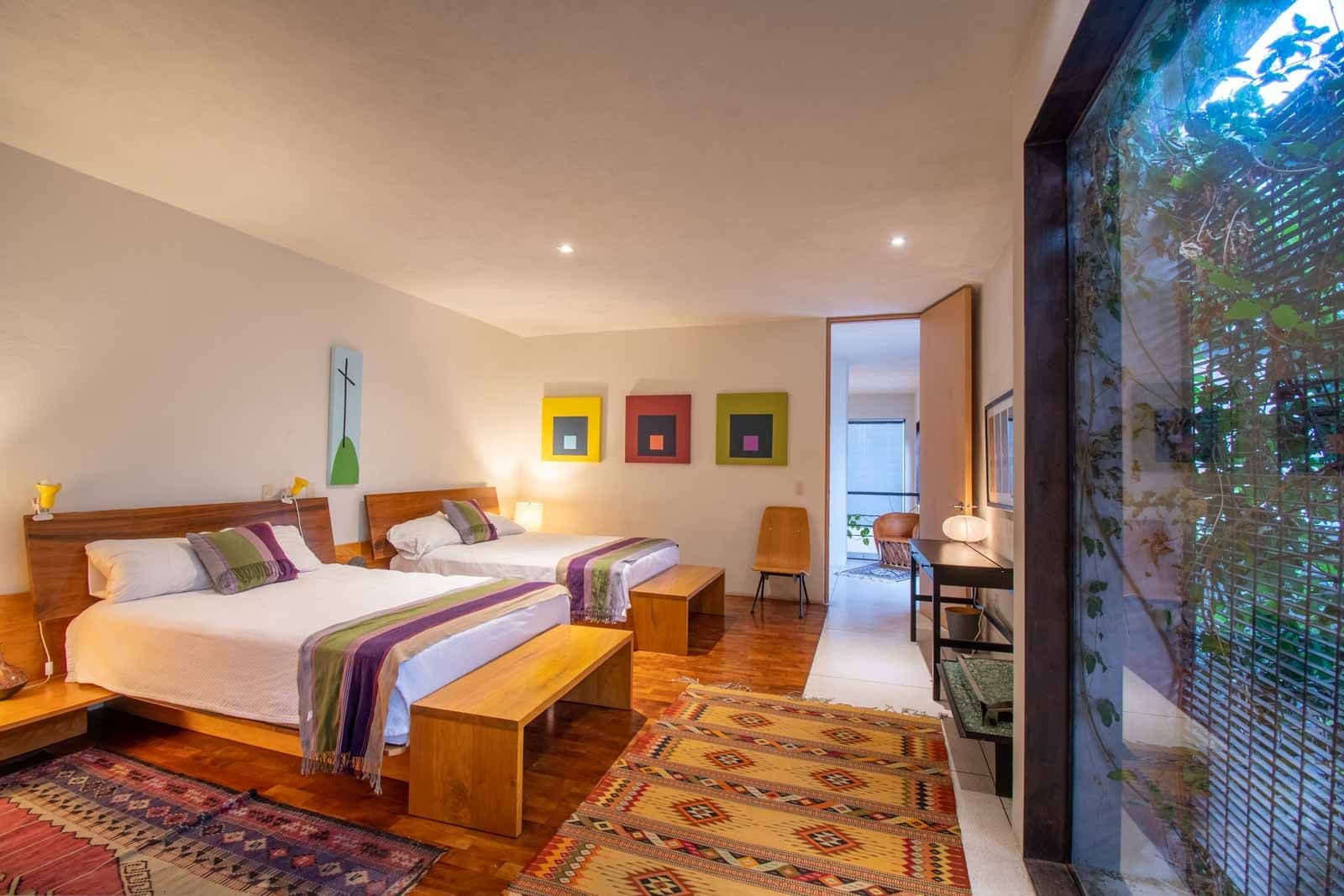 Casa Doce — Centro, San Miguel de Allende — photo 19 — serene dual-bed guest sanctuary with warmth