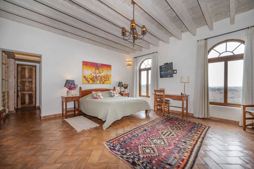 Casa Cactus — El Cortijo, San Miguel de Allende — photo 10 — luminous master suite, sweeping countryside vistas