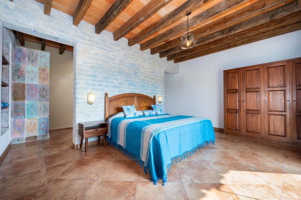 Casa Cactus — El Cortijo, San Miguel de Allende — photo 21 — rustic charm meets serene luxury bedroom