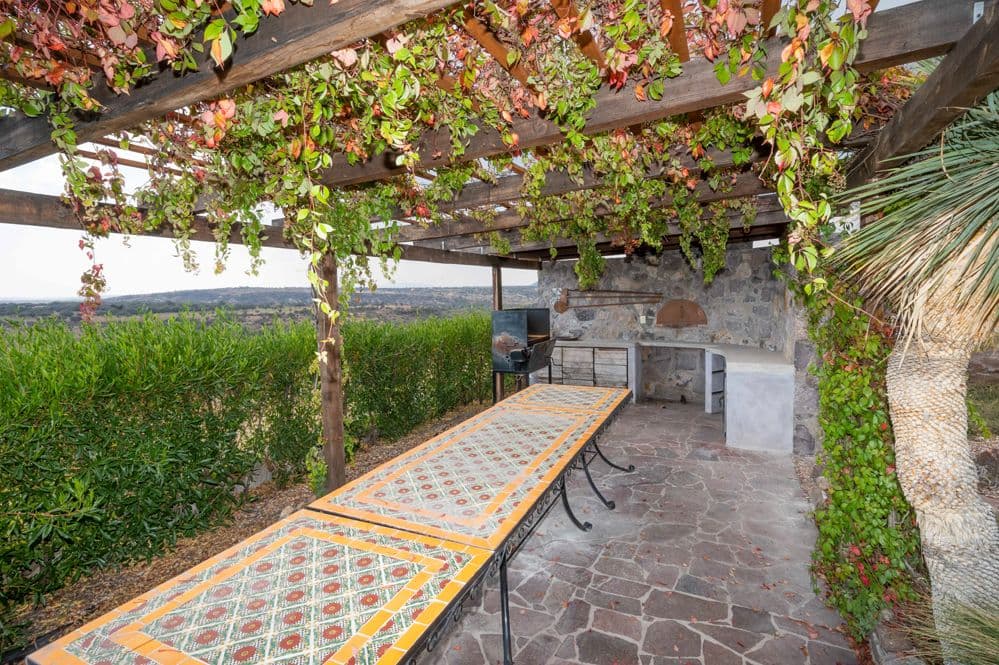 Casa Cactus — El Cortijo, San Miguel de Allende — photo 14 — verdant pergola, panoramic countryside vistas