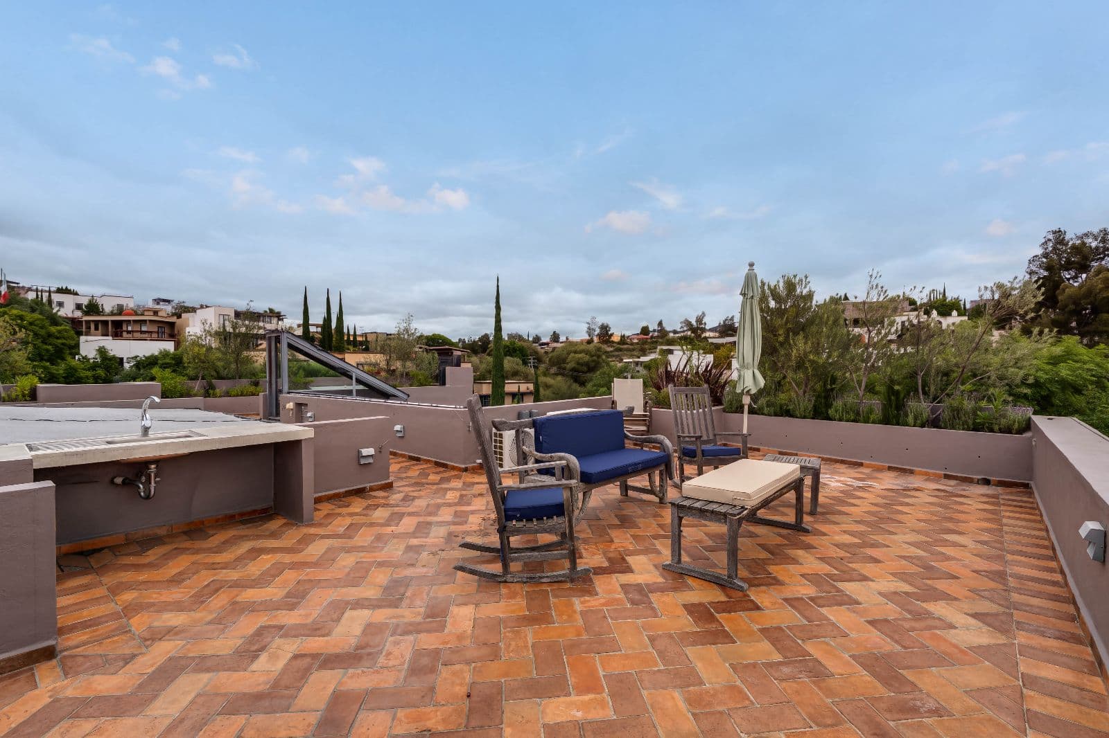 Casa Iluminada — Balcones, San Miguel de Allende — photo 20 — expansive rooftop terrace, panoramic valley views