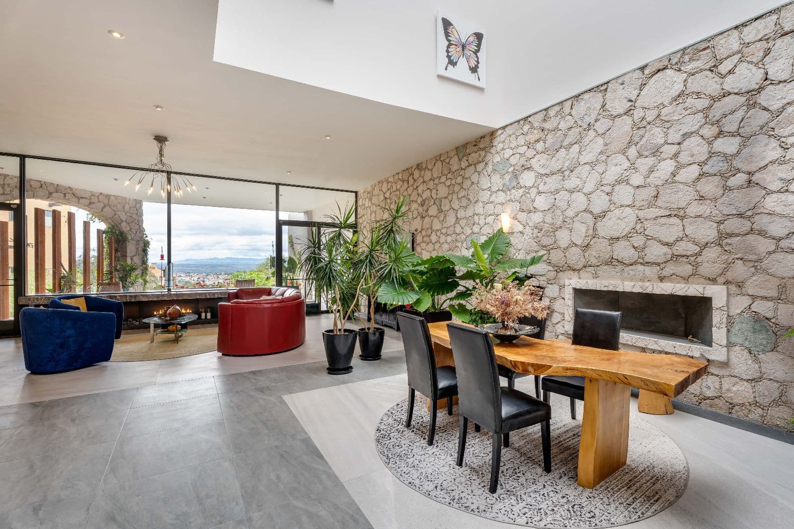 Casa Iluminada — Balcones, San Miguel de Allende — photo 3 — sophisticated stone-walled entertaining space