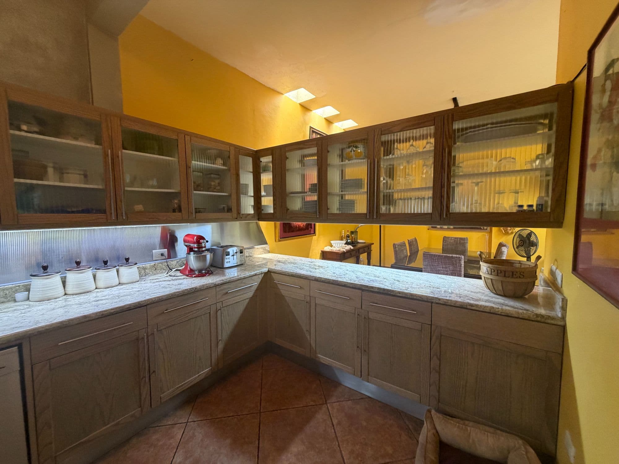 Casa Clinton — Caracol, San Miguel de Allende — photo 6 — sunlit traditional kitchen, warm elegance
