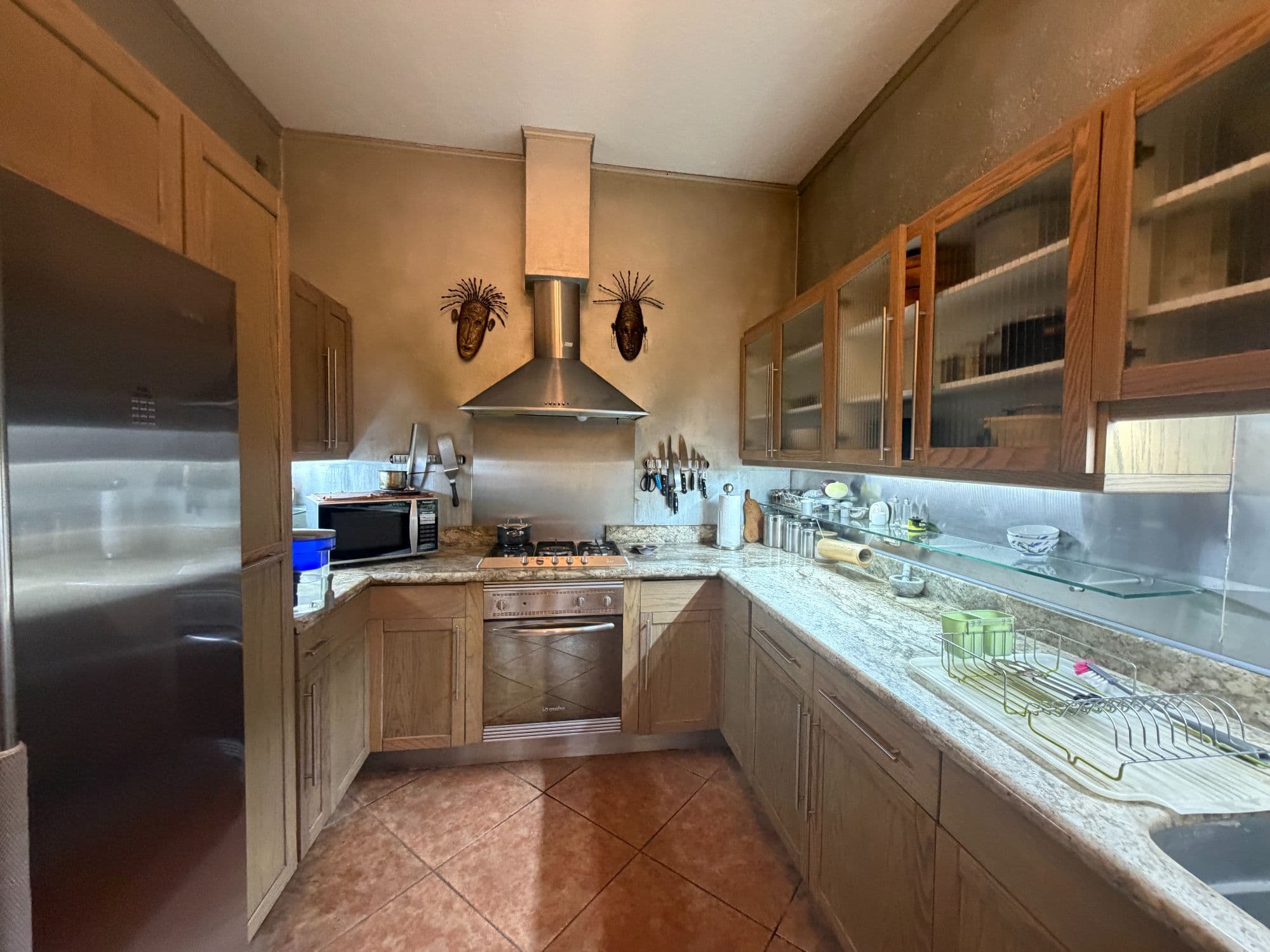 Casa Clinton — Caracol, San Miguel de Allende — photo 7 — sophisticated chef's kitchen, warm ambiance