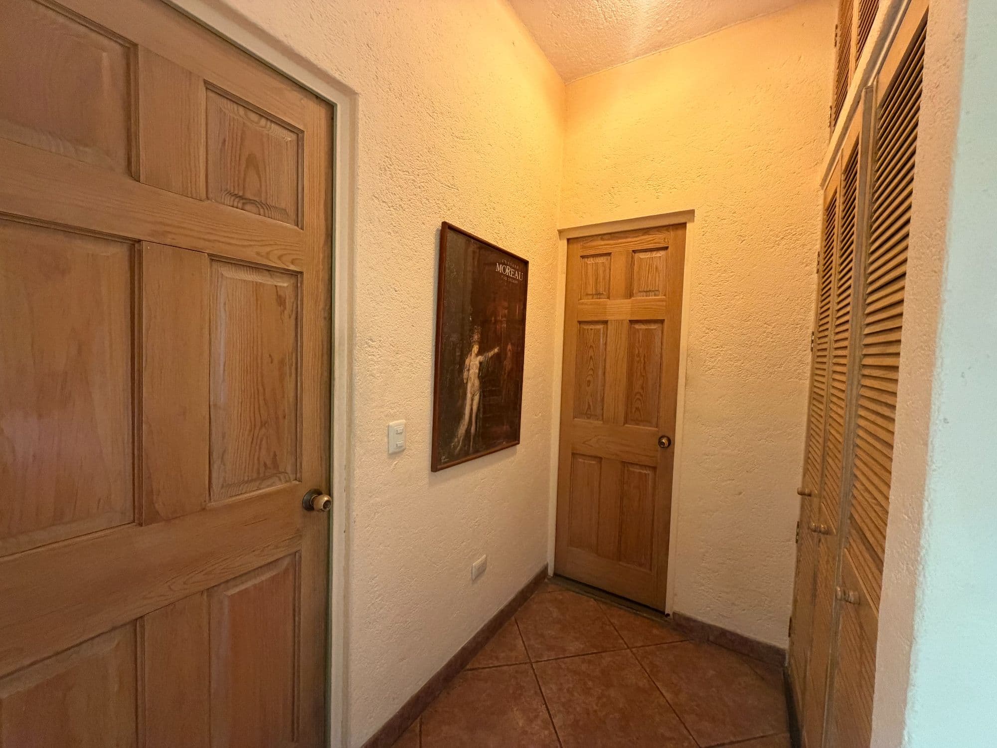 Casa Clinton — Caracol, San Miguel de Allende — photo 9 — warm hallway with rustic wooden character
