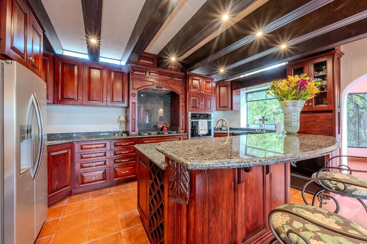Casa Java — Atascadero (Arcos de San Miguel), San Miguel de Allende — photo 10 — sophisticated cherry wood chef's kitchen