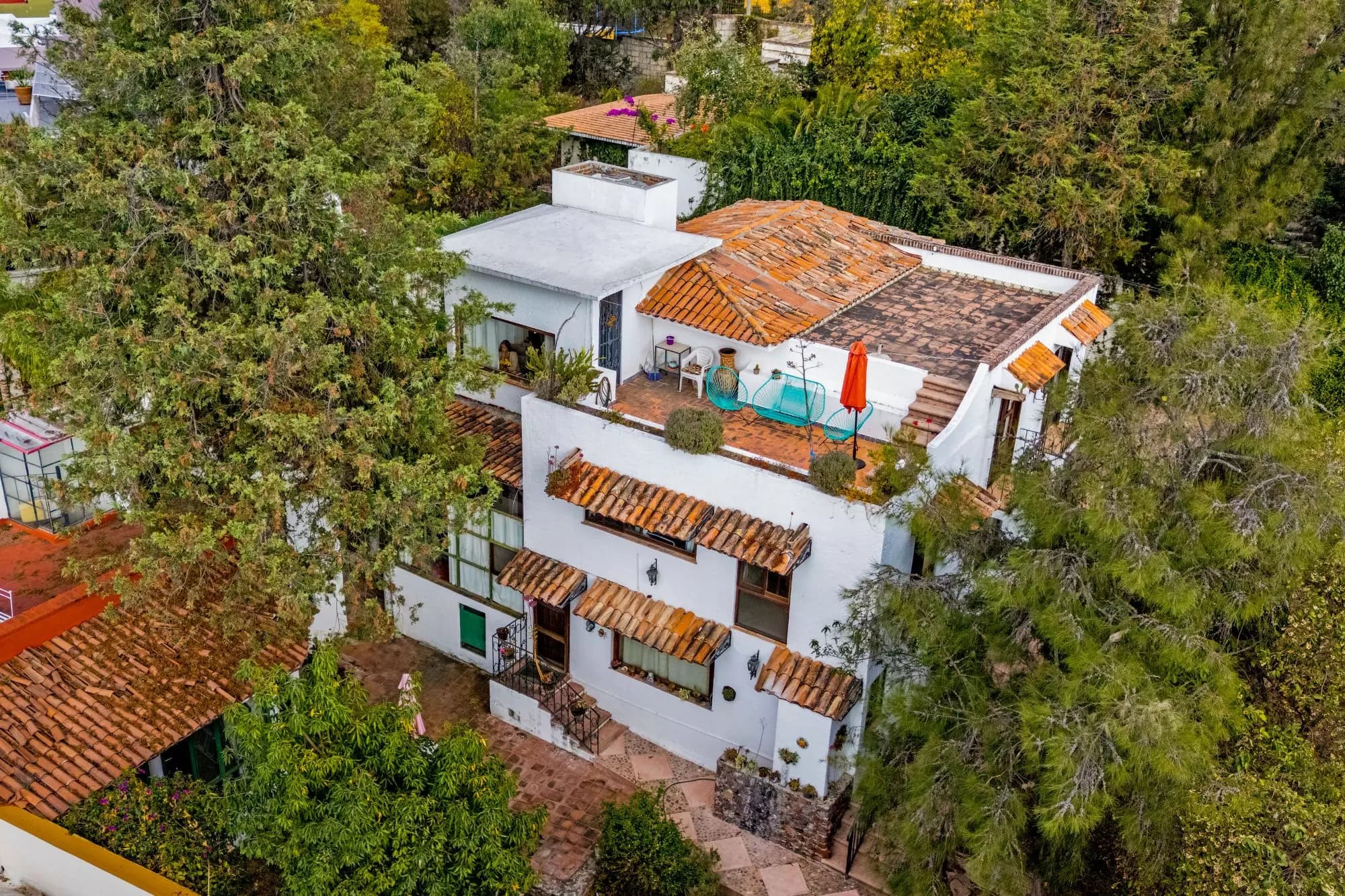 The Hidden House — Rinconada de Los Balcones, San Miguel de Allende — photo 3 — terraced colonial elegance amid verdant landscape