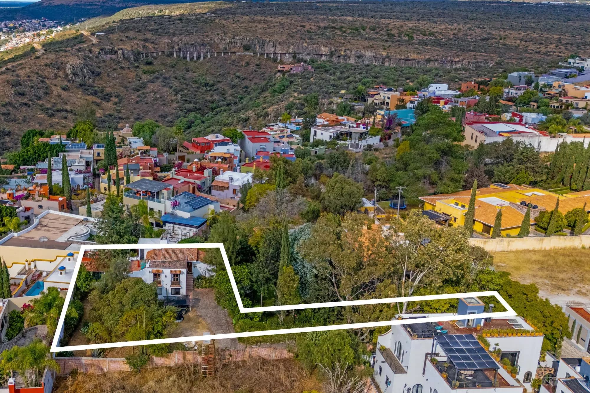 The Hidden House — Rinconada de Los Balcones, San Miguel de Allende — photo 6 — verdant valley views, architectural potential awaits