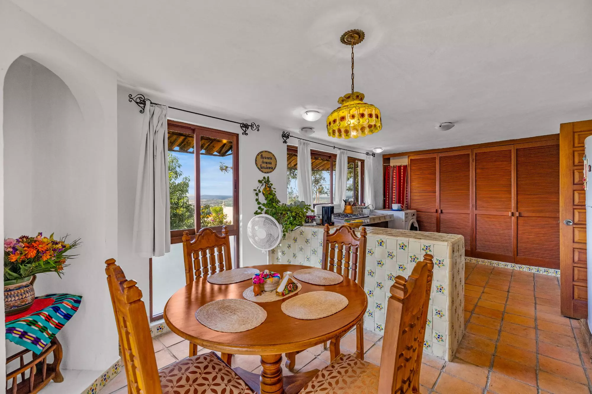 The Hidden House — Rinconada de Los Balcones, San Miguel de Allende — photo 8 — sun-drenched dining with panoramic valley views
