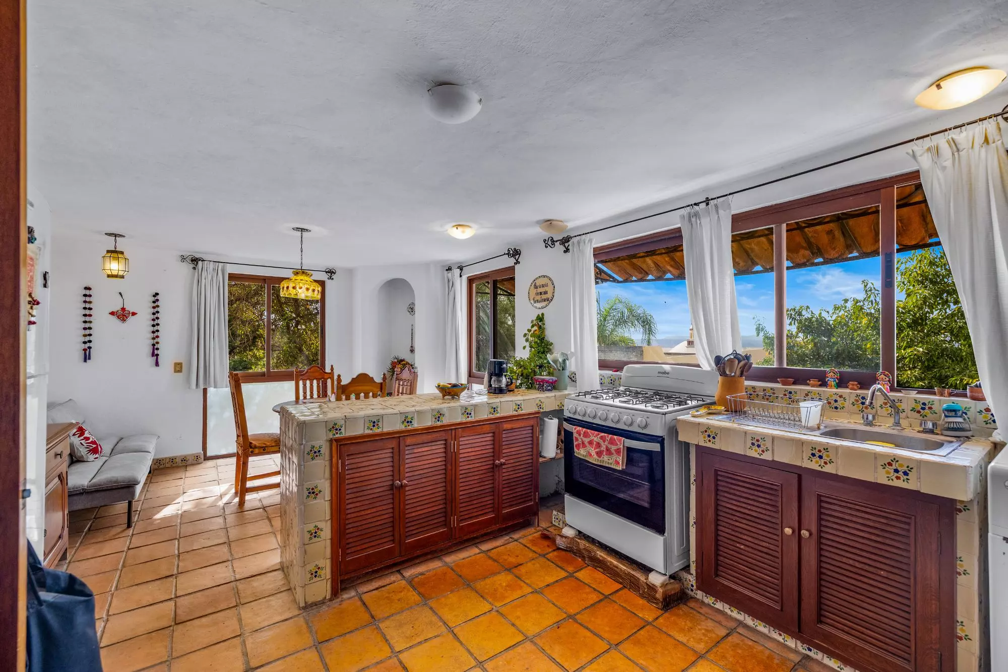 The Hidden House — Rinconada de Los Balcones, San Miguel de Allende — photo 17 — sunlit traditional kitchen with panoramic views
