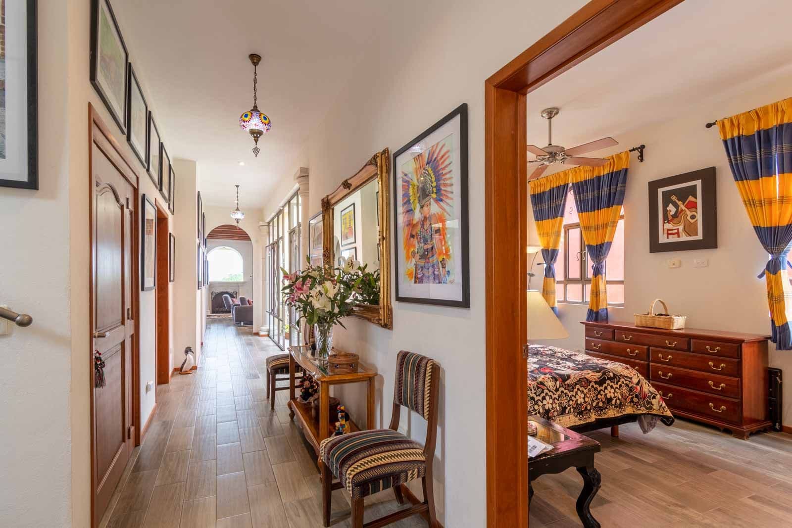 Casa Dar — El Capricho, San Miguel de Allende — photo 4 — elegant hallway with curated art collection