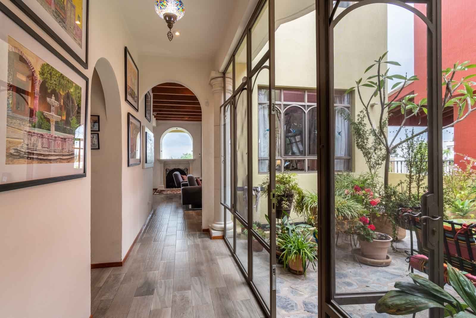 Casa Dar — El Capricho, San Miguel de Allende — photo 8 — elegant gallery hallway, serene courtyard views