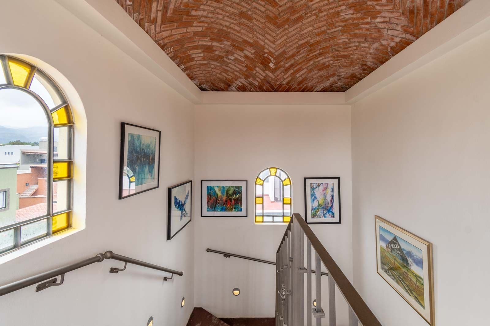 Casa Dar — El Capricho, San Miguel de Allende — photo 27 — soaring colonial stairwell with artistic light