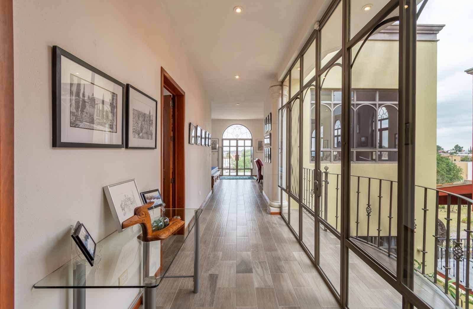 Casa Dar — El Capricho, San Miguel de Allende — photo 21 — luminous gallery hallway, stunning valley views