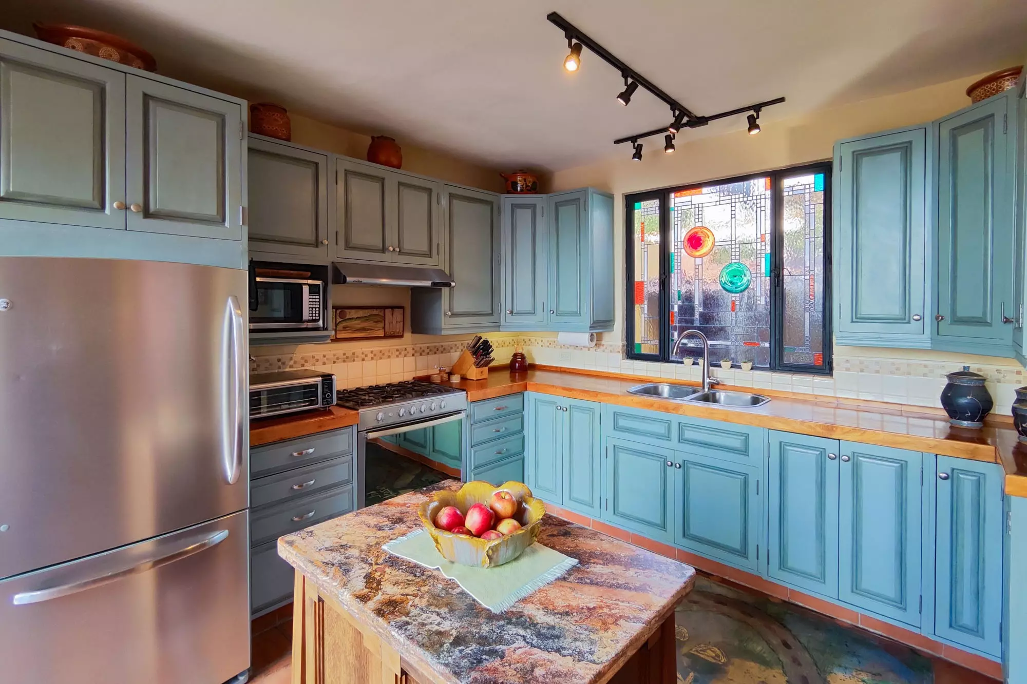 Casa Colina — Balcones, San Miguel de Allende — photo 11 — vibrant, artisanal kitchen with colonial charm