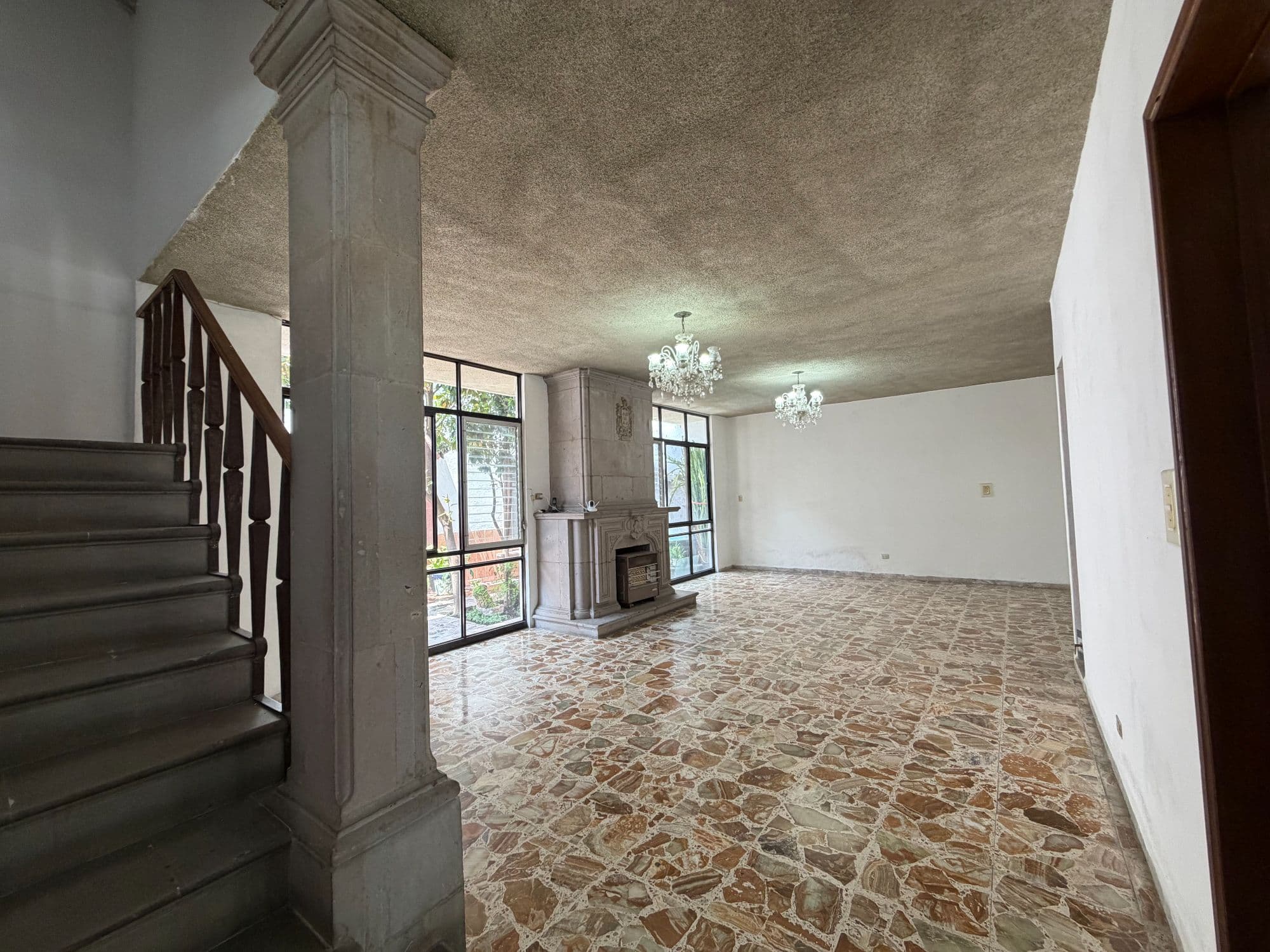 Casa Torres — Centro, San Miguel de Allende — photo 57 — luminous double-height living space awaits