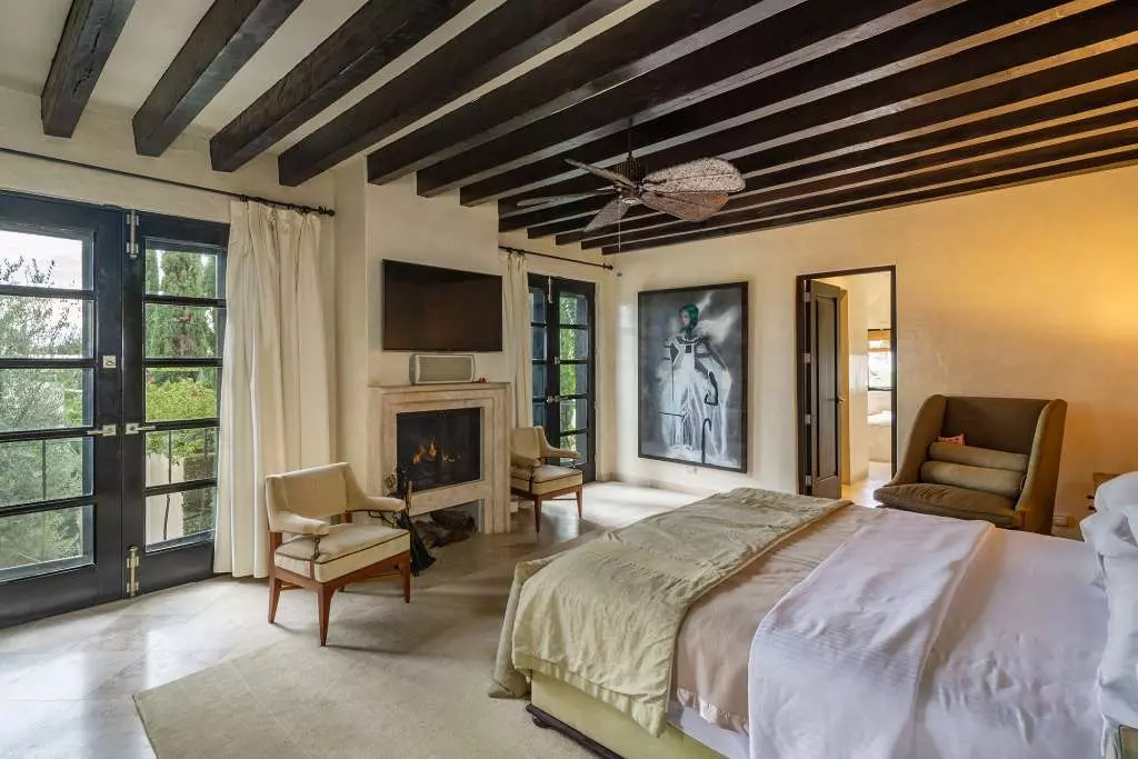 Casa Stream — Centro, San Miguel de Allende — photo 7 — luminous master suite, exposed beams, fireplace