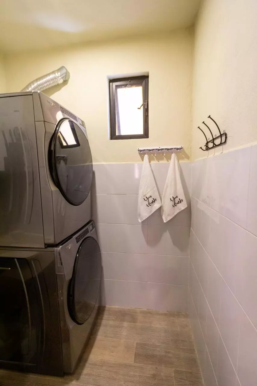 Departamento Nahme Quintas de Allende — Quinta de Allende, San Miguel de Allende — photo 11 — bright, efficient laundry room